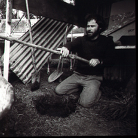 Chris Booth digging a hole to support his large pole work Aramoana 