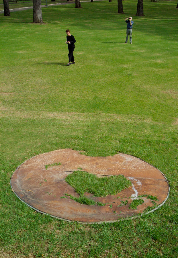 Lloyd Godman discarded corrugated iron water storage tank lid - grass